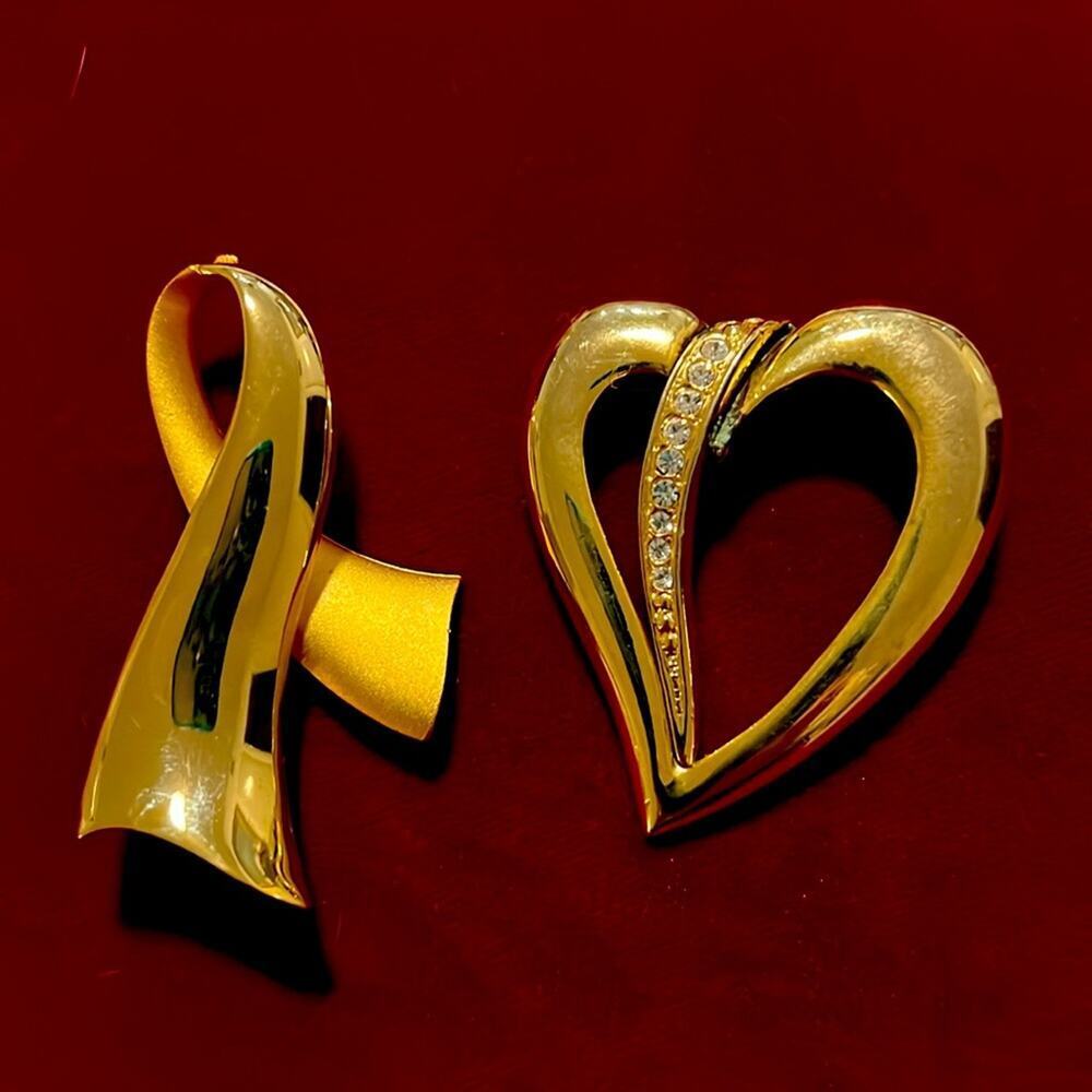 Two Gold Tone Crystal Brooches